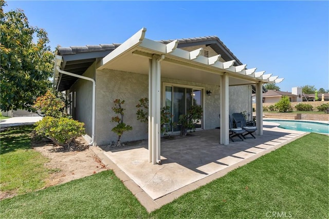 5410 Via, San Jacinto, Riverside, CA 92506 - back of property featuring stucco siding, a patio, an outdoor pool, and a lawn