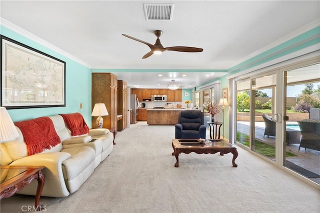5410 Via, San Jacinto, Riverside, CA 92506 - living room featuring light colored carpet, ornamental molding, and a ceiling fan