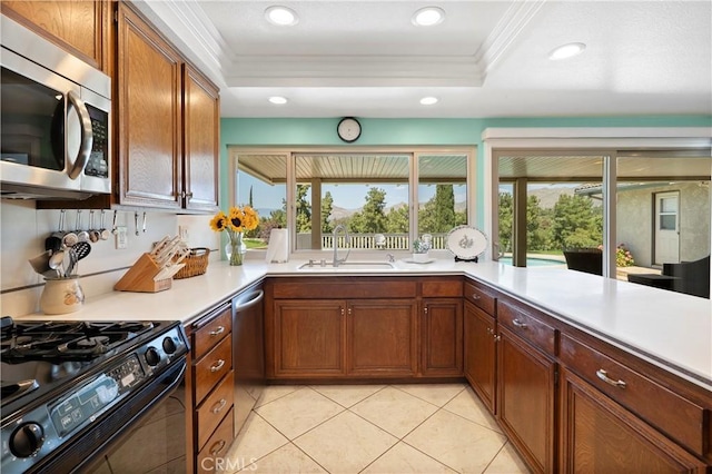 5410 Via, San Jacinto, Riverside, CA 92506 - kitchen with stainless steel appliances, a sink, crown molding, light countertops, and a tray ceiling