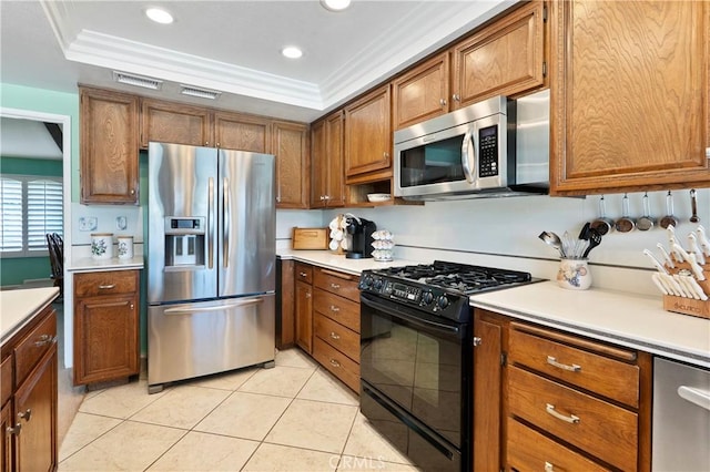 5410 Via, San Jacinto, Riverside, CA 92506 - kitchen with appliances with stainless steel finishes, brown cabinetry, light countertops, light tile patterned flooring, and recessed lighting