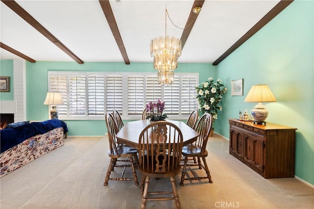 5410 Via, San Jacinto, Riverside, CA 92506 - carpeted dining area featuring a chandelier, beam ceiling, baseboards, and a brick fireplace