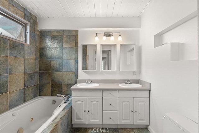 full bath with a sink, wood ceiling, a tub with jets, and double vanity