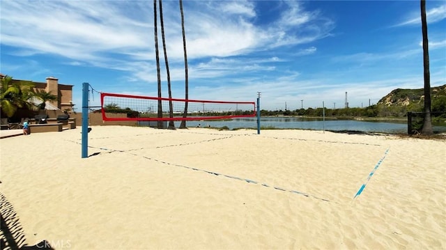 view of community featuring a water view and volleyball court