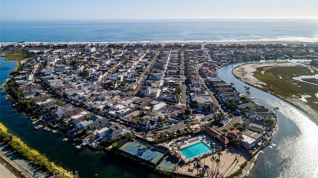birds eye view of property with a water view and a residential view