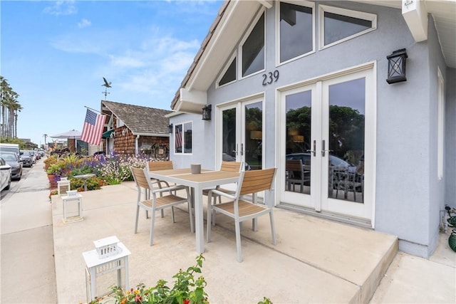view of patio / terrace with french doors and outdoor dining space
