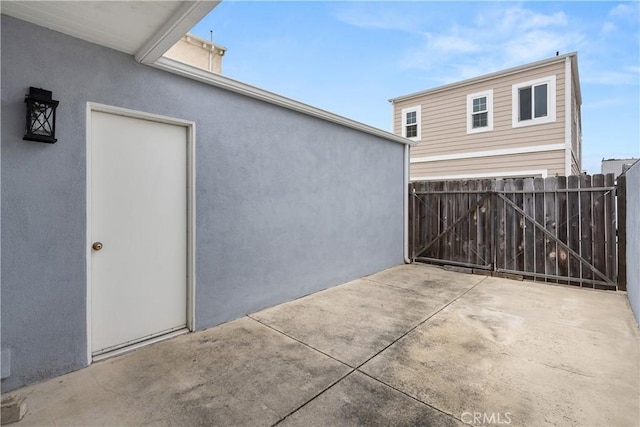 view of patio featuring fence