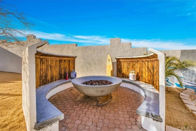 7423 Juniper Rd, Joshua Tree, CA 92252 - view of patio featuring a fire pit