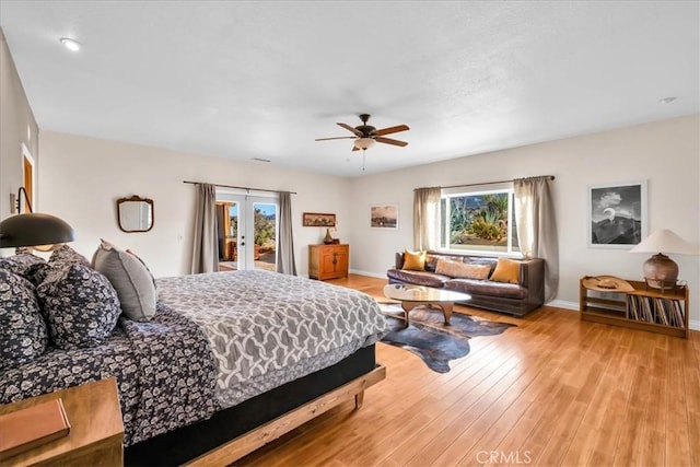 7423 Juniper Rd, Joshua Tree, CA 92252 - bedroom with access to outside, french doors, a ceiling fan, baseboards, and light wood-type flooring
