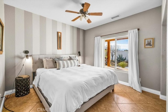 7423 Juniper Rd, Joshua Tree, CA 92252 - bedroom with light tile patterned floors, baseboards, a ceiling fan, and visible vents