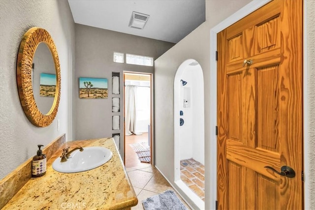 7423 Juniper Rd, Joshua Tree, CA 92252 - bathroom with a walk in shower, visible vents, tile patterned flooring, and vanity