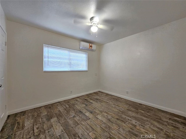 1412 S White Ave, Pomona, CA 91766 - spare room with a ceiling fan, baseboards, wood finished floors, and a wall mounted air conditioner