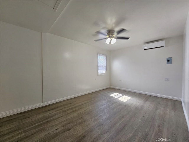 1412 S White Ave, Pomona, CA 91766 - unfurnished room featuring baseboards, an AC wall unit, a ceiling fan, and wood finished floors