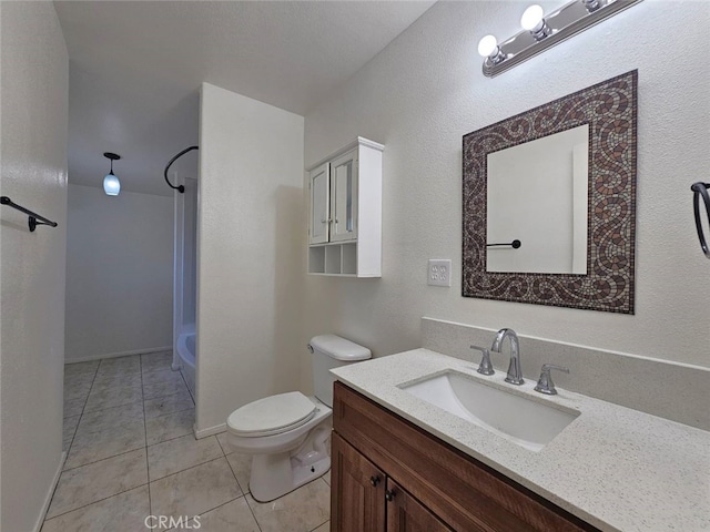1412 S White Ave, Pomona, CA 91766 - bathroom featuring vanity, tile patterned flooring, baseboards, and toilet