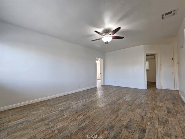 1412 S White Ave, Pomona, CA 91766 - spare room featuring a ceiling fan, baseboards, visible vents, and dark wood-type flooring