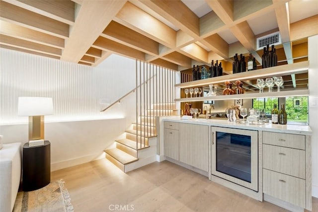 13817 Valley Vista Blvd, Sherman Oaks, CA 91423 - indoor bar with beverage cooler, light wood finished floors, stairs, beamed ceiling, and coffered ceiling