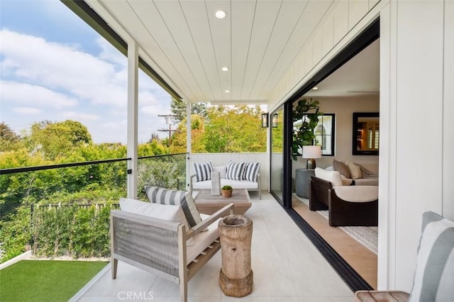 sunroom / solarium with an outdoor hangout area