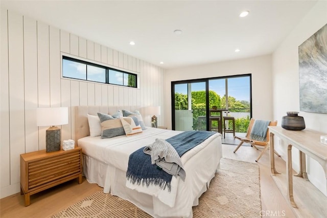bedroom with access to outside, recessed lighting, and light wood-style flooring