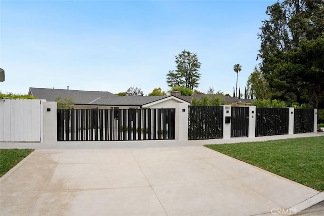 view of gate featuring a fenced front yard