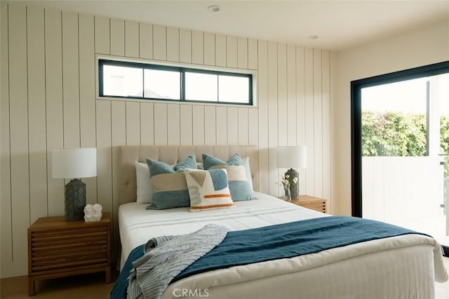 bedroom with wooden walls