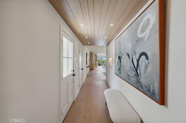 hall featuring recessed lighting, wood ceiling, and light wood finished floors