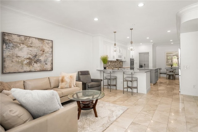 living area featuring crown molding, baseboards, recessed lighting, and marble finish floor