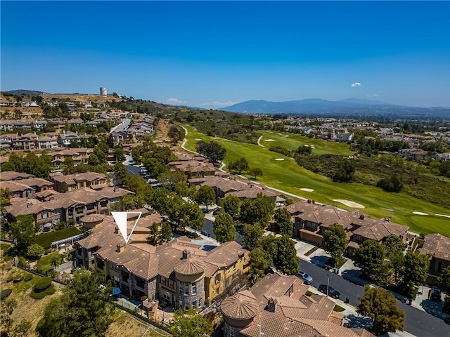 aerial view with a residential view, a mountain view, and golf course view