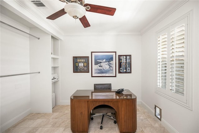 home office with crown molding, baseboards, ceiling fan, and visible vents
