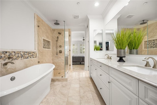 full bathroom with a sink, ornamental molding, a stall shower, and double vanity