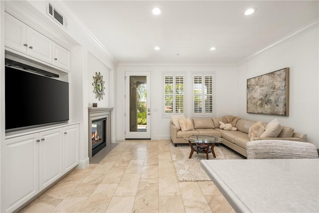 living area with visible vents, marble finish floor, a glass covered fireplace, ornamental molding, and recessed lighting