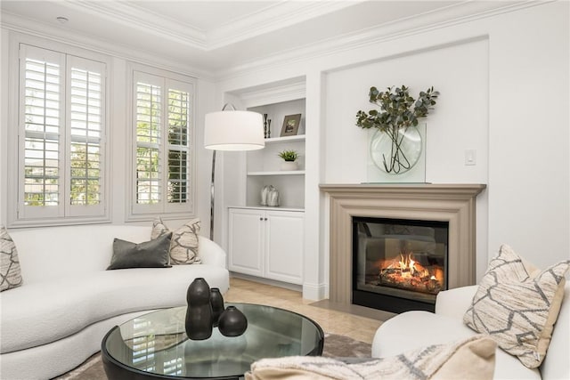 living area featuring a fireplace with flush hearth, ornamental molding, and built in shelves