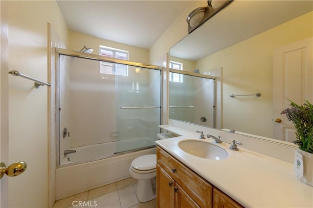 10925 Kimball Pl, Tustin, CA 92782 - bathroom featuring tile patterned floors, vanity, toilet, and shower / bath combination with glass door