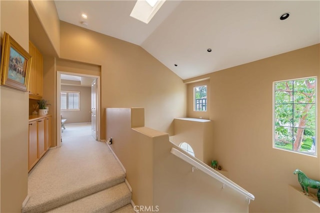 10925 Kimball Pl, Tustin, CA 92782 - hallway with recessed lighting, lofted ceiling with skylight, and an upstairs landing
