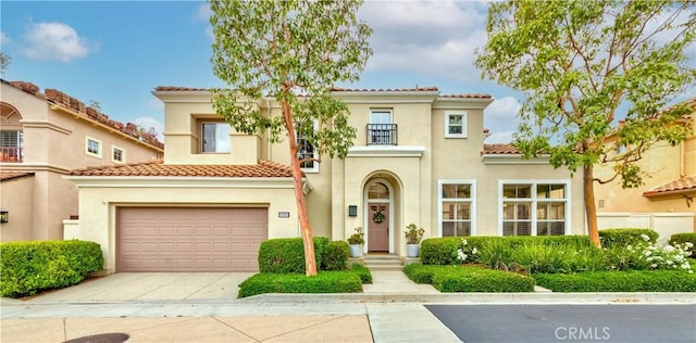 10925 Kimball Pl, Tustin, CA 92782 - mediterranean / spanish-style house with concrete driveway, a tile roof, and stucco siding