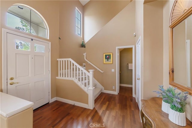 10925 Kimball Pl, Tustin, CA 92782 - foyer featuring stairs, baseboards, wood finished floors, and a towering ceiling