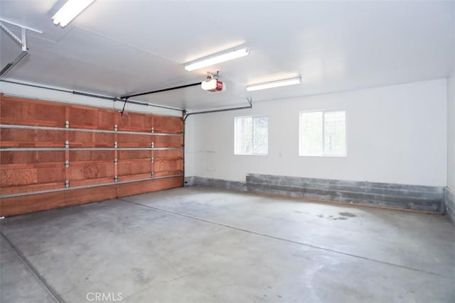 garage featuring a garage door opener