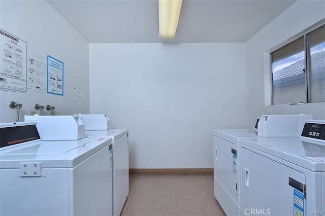 common laundry area with baseboards and washer and dryer
