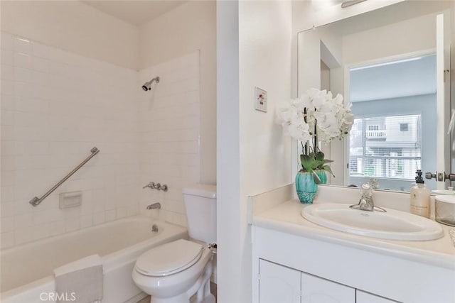 bathroom featuring toilet, shower / washtub combination, and vanity