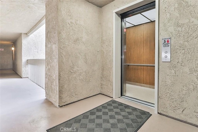 view of exterior entry featuring elevator