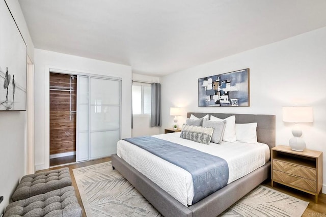 bedroom featuring wood finished floors and a closet
