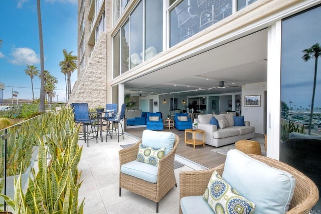 view of patio / terrace featuring ceiling fan and outdoor lounge area