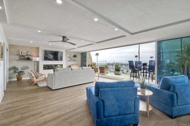 living room with recessed lighting, ceiling fan, and wood finished floors