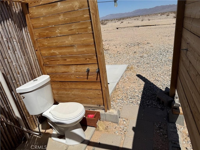 bathroom featuring toilet and a mountain view