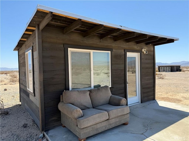 view of outbuilding with a mountain view