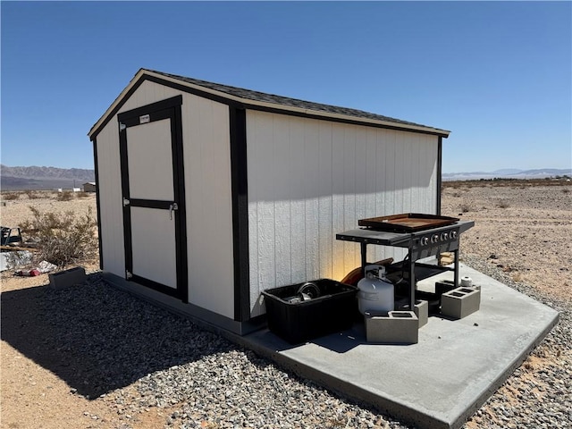 view of shed with a mountain view