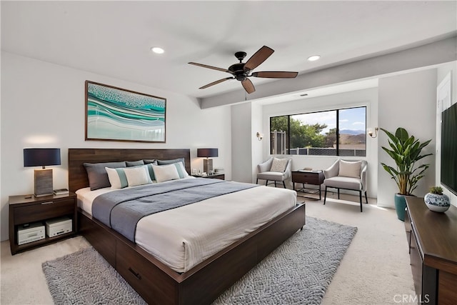 bedroom featuring recessed lighting, a ceiling fan, and light carpet