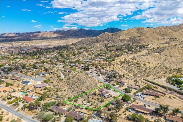 drone / aerial view with a mountain view and view of desert