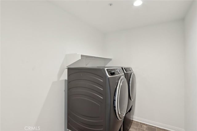 687 Ballesteros St, Perris, CA 92571 - clothes washing area with baseboards, laundry area, washing machine and dryer, and recessed lighting