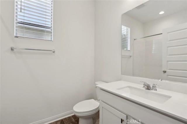 687 Ballesteros St, Perris, CA 92571 - full bathroom featuring toilet, baseboards, a shower, and vanity