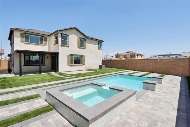 687 Ballesteros St, Perris, CA 92571 - back of house featuring a fenced backyard, a lawn, and a patio area