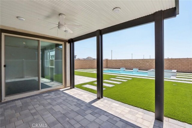 687 Ballesteros St, Perris, CA 92571 - view of patio / terrace with a fenced backyard, a ceiling fan, and a pool with connected hot tub